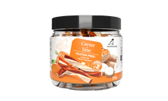 Jar of carrot yam dog treats with a black lid on a white background
