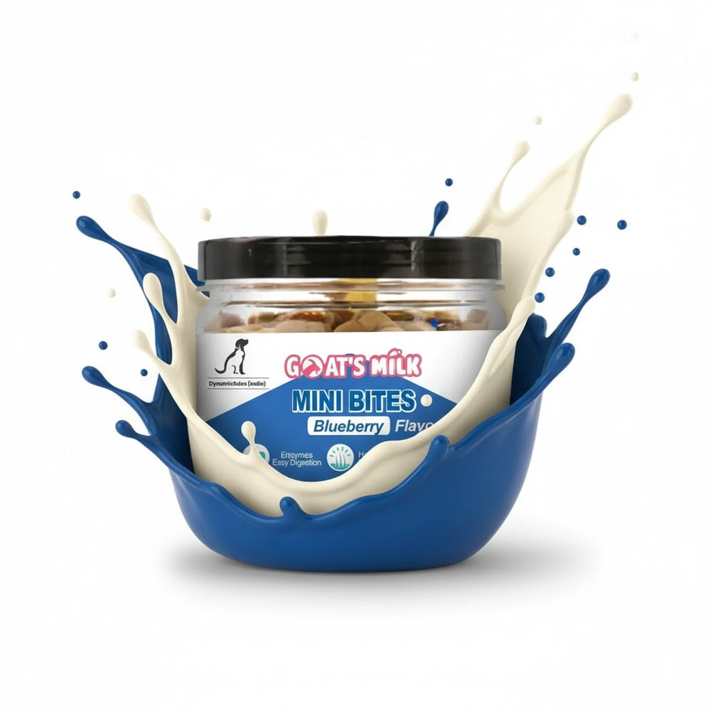 Jar of 'Goat's Milk Mini Bites' with blueberry flavor surrounded by splashes of milk on a white background