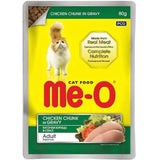Me-O cat food package with chicken chunk in gravy on a yellow background