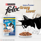 Purina Felix Gravy Lover cat food packaging with a cartoon cat eating from a bowl on a white background.