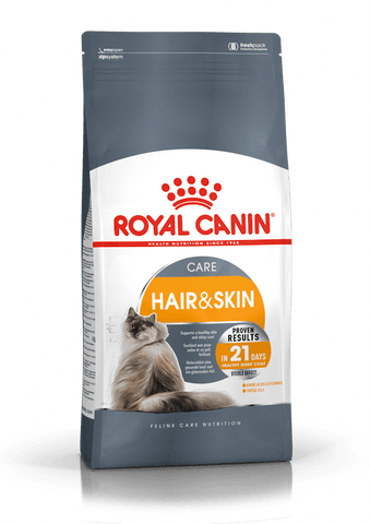 A bag of Royal Canin Hair & Skin Care Adult Dry Cat Food featuring the brand's logo, a cat, and text highlighting the product's benefits for adult cats' hair and skin.