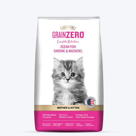 A bag of Signature Grain Zero Ocean Fish, Sardine and Mackerel Mother and Kitten Cat Dry Food featuring an image of a small kitten and a cat with ocean fish.