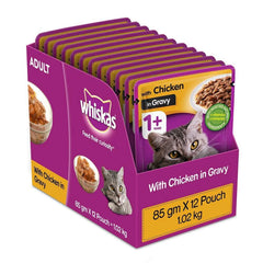 Box of Whiskas cat food pouches with chicken in gravy on a white background