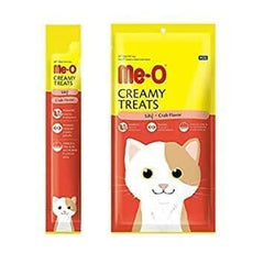 Two packages of Me-O Creamy Treats for cats on a white background