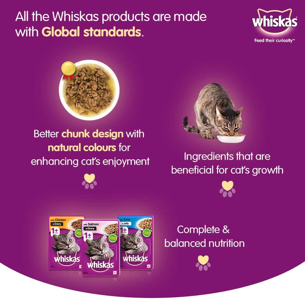 Whiskas cat food advertisement with a purple background, showing a bowl of cat food, a cat eating, and Whiskas packaging.