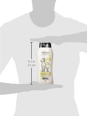 Wahl Oatmeal Shampoo bottle held by a person to show size