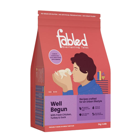 Fabled pet food package with a person holding a puppy on a red background