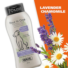 Wahl Four In One shampoo and conditioner bottle with lavender and chamomile flowers on an orange background