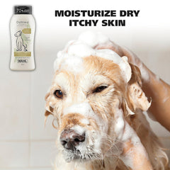 Dog being bathed with a bottle of Wahl Oatmeal Shampoo on a light background