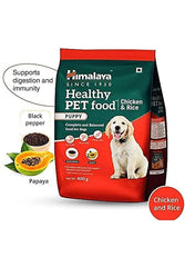 Himalaya Healthy Pet Food for puppies with chicken and rice on a white background