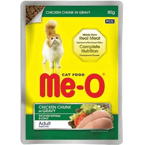 Me-O cat food package with chicken chunk in gravy on a yellow background