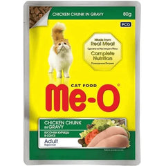 Me-O cat food package with chicken chunk in gravy on a yellow background