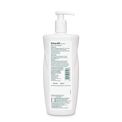 White shampoo bottle with pump on a white background