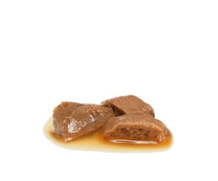 Three pieces of brown fudge on a white background