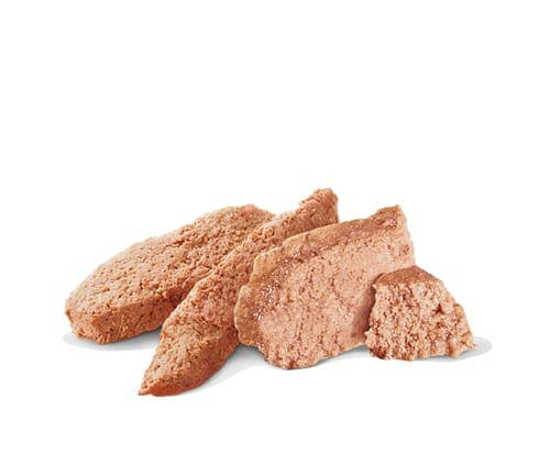 Three pieces of brown dog treat on a white background