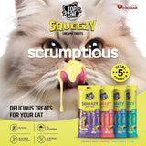 Cat eating a Top Cat Squeezy treat with product packaging displayed.