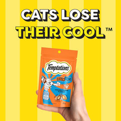 Temptations cat treats package held in front of a yellow background with text 'Cats Lose Their Cool'.