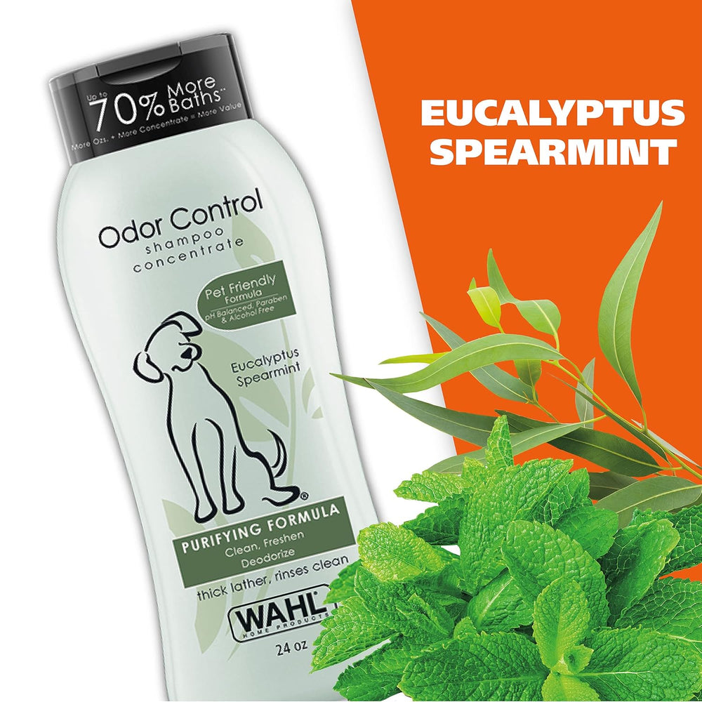 Wahl Odor Control shampoo concentrate bottle with eucalyptus and spearmint leaves on an orange background