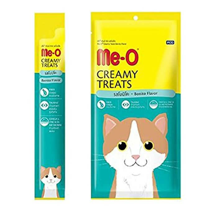 Two packages of Me-O Creamy Treats for cats on a white background
