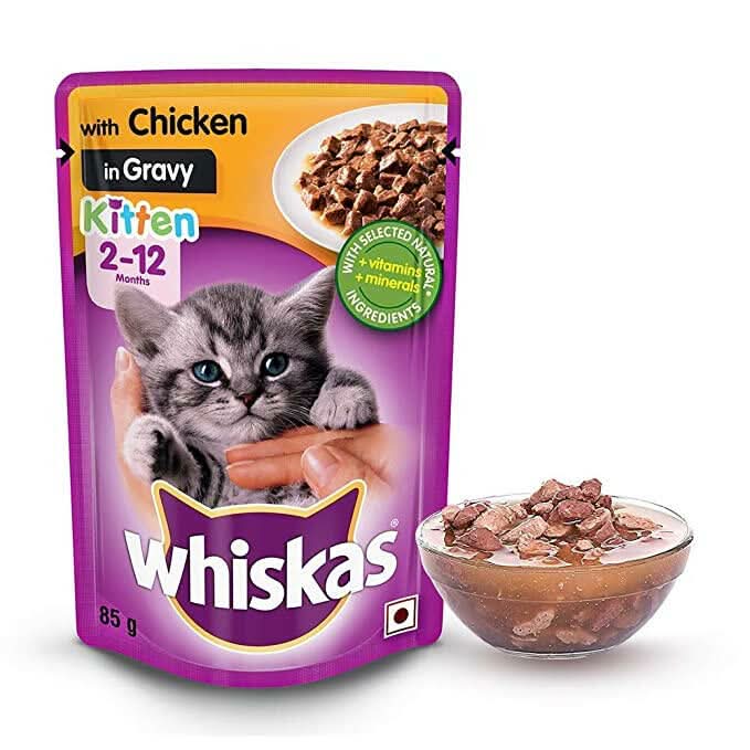 Whiskas kitten food pouch with a bowl of cat food on a white background