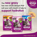 Three Whiskas cat food packets with promotional text on a light background